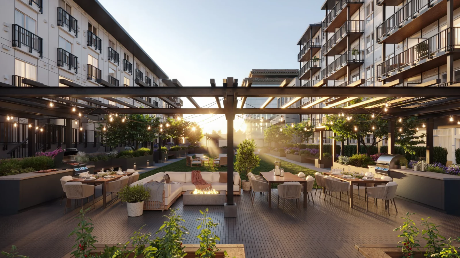 Landscaped courtyard at Spencer Block with outdoor dining, lounge seating, fire table and BBQ areas