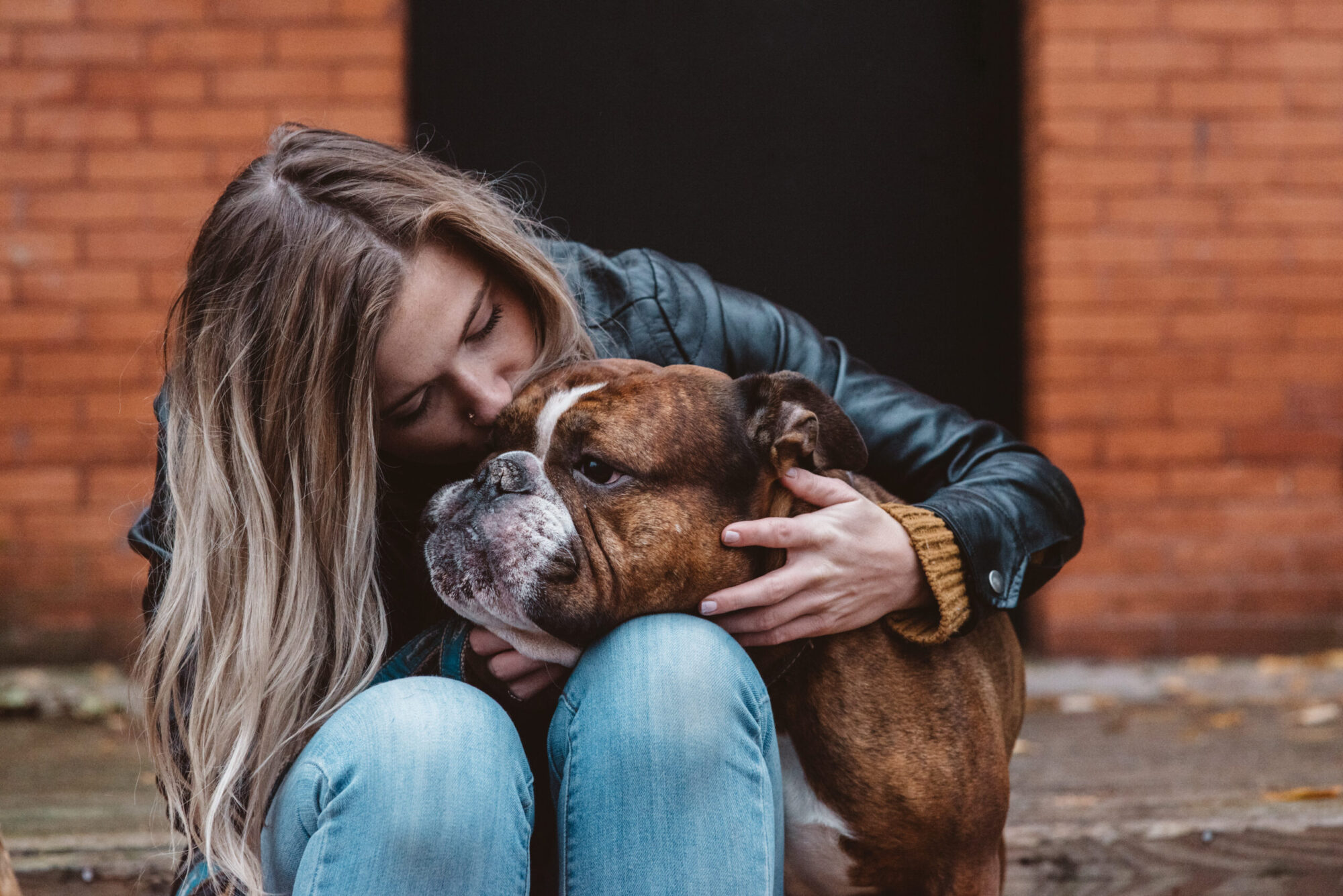 Woman enjoying time with her dog in a downtown neighbourhood