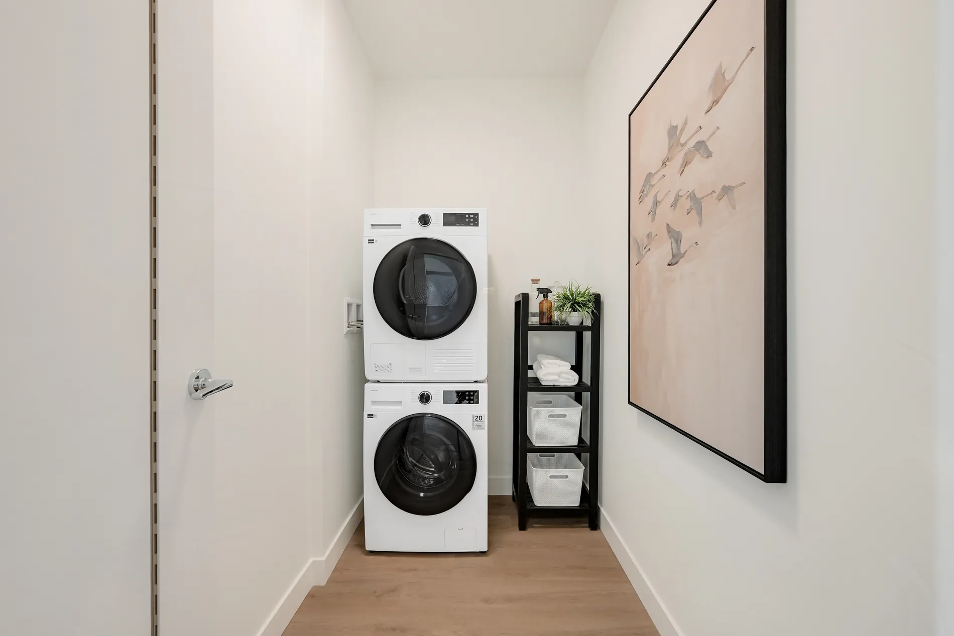 In-suite laundry, stacked washer and dryer in a Spencer Block 2-bedroom rental home